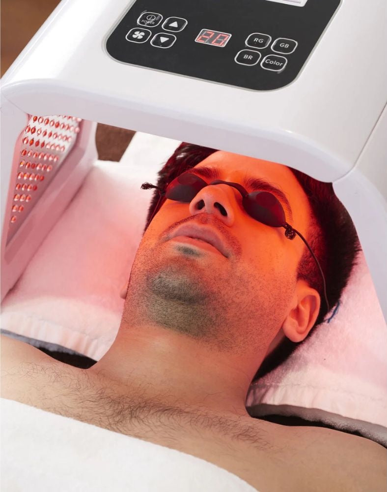 Omega Bright LED Light Therapy Device in use during red light skin treatment for men. Ideal for at-home 7-color skin rejuvenation and anti-aging care.