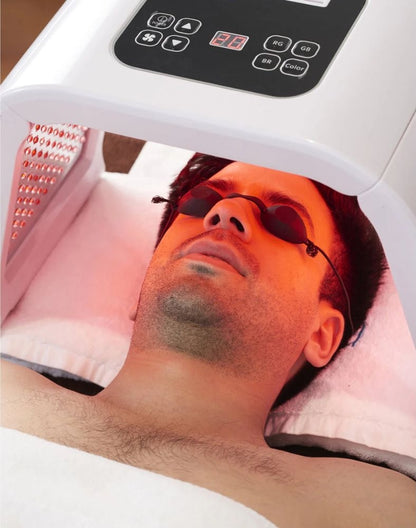 Omega Bright LED Light Therapy Device in use during red light skin treatment for men. Ideal for at-home 7-color skin rejuvenation and anti-aging care.