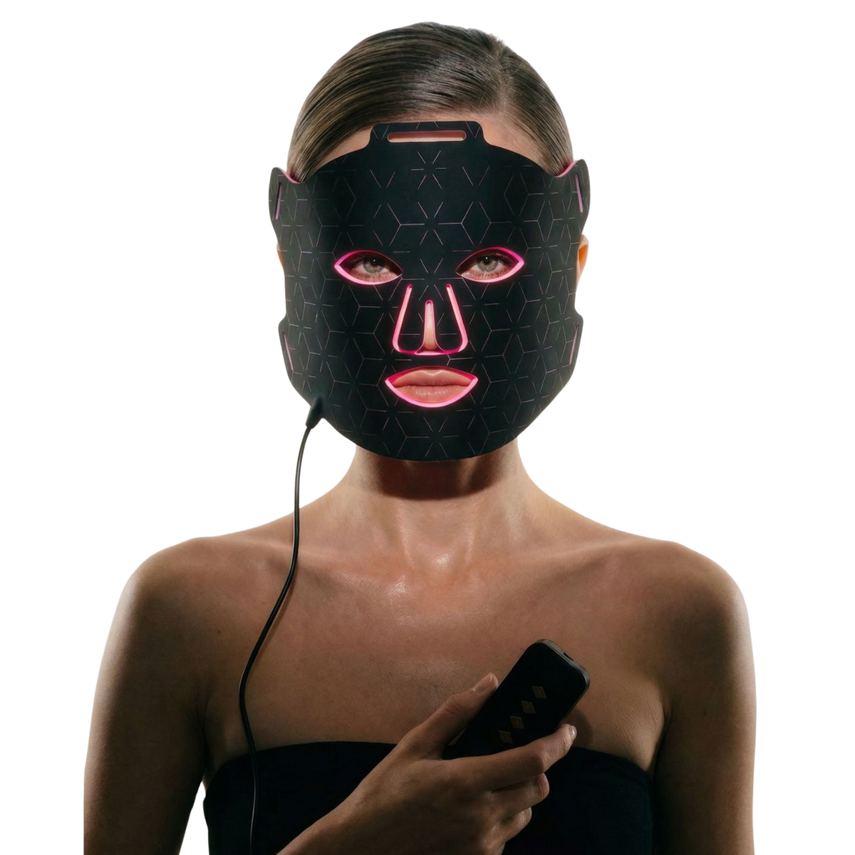 A woman wearing a Luminmax LED light therapy face mask with glowing pink accents